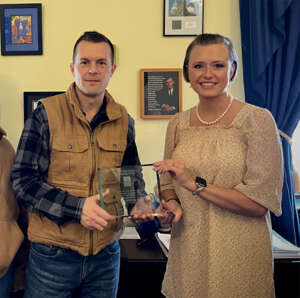 Jared Golden plaque presentation with Shanna Chamblee