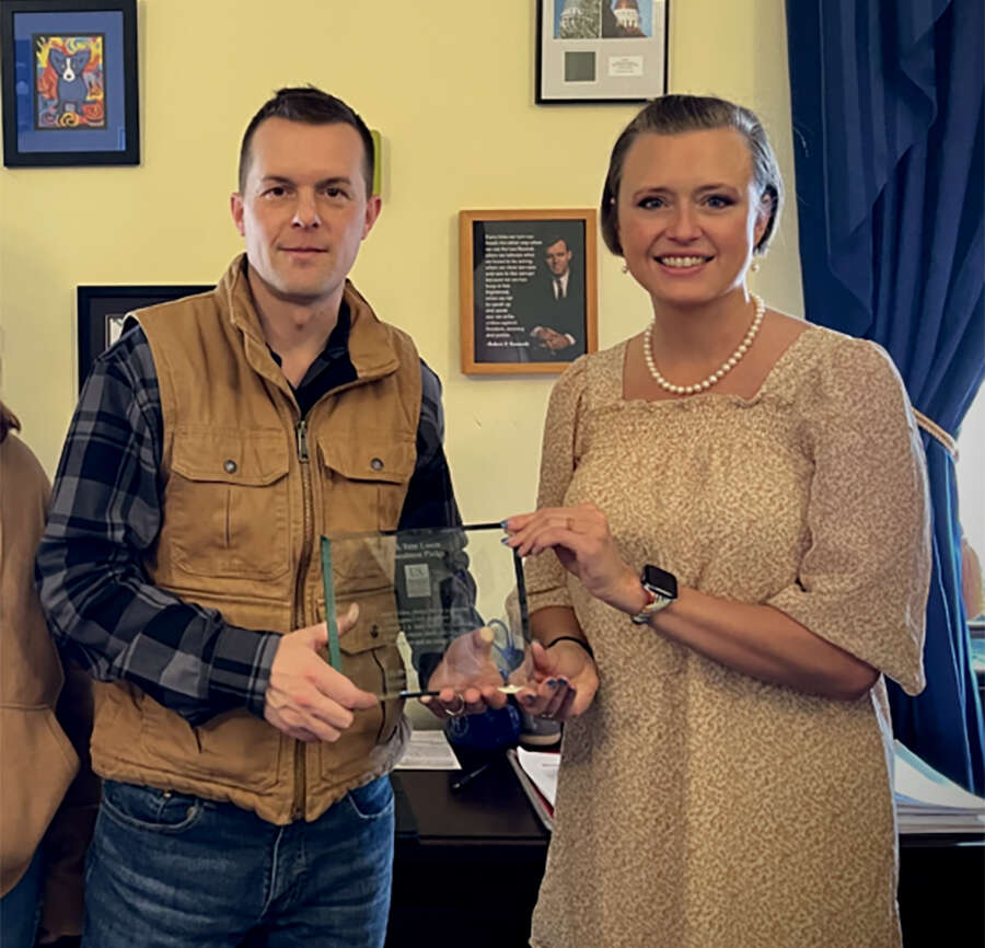 Jared Golden plaque presentation with Shanna Chamblee